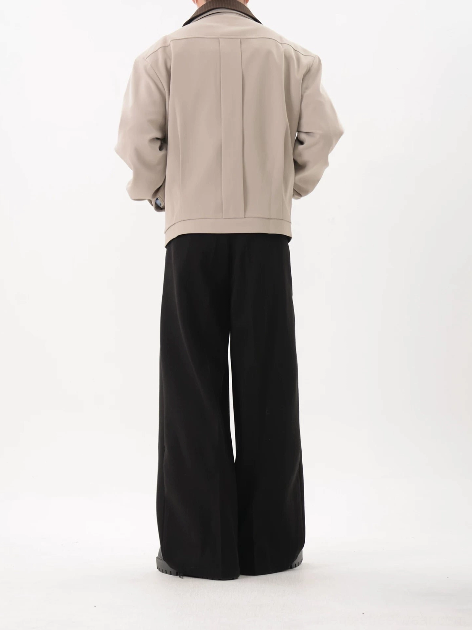 Light gray cropped blouson jacket back view showing relaxed fit back yoke seam and straight hip length hem