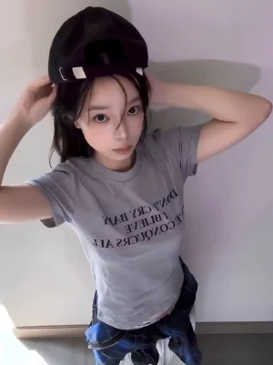 Light gray Korean streetwear slogan T-shirt with centered black serif lettering and classic crew neck