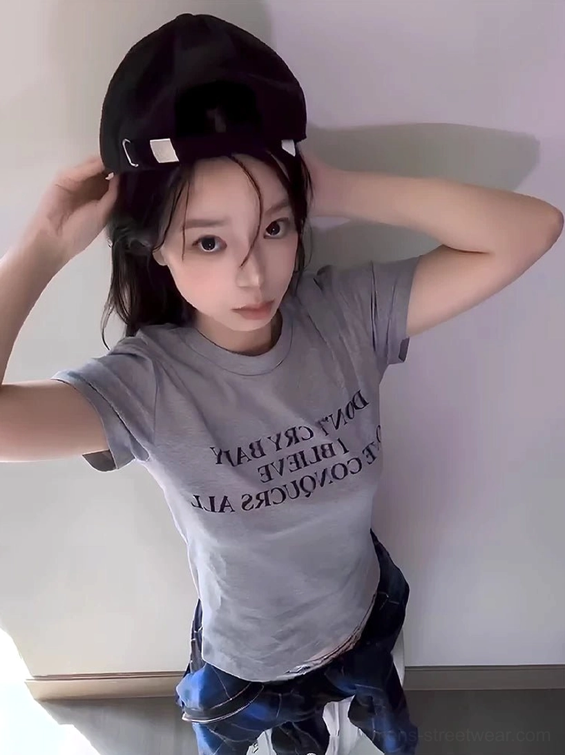Light gray Korean streetwear slogan T-shirt with centered black serif lettering and classic crew neck