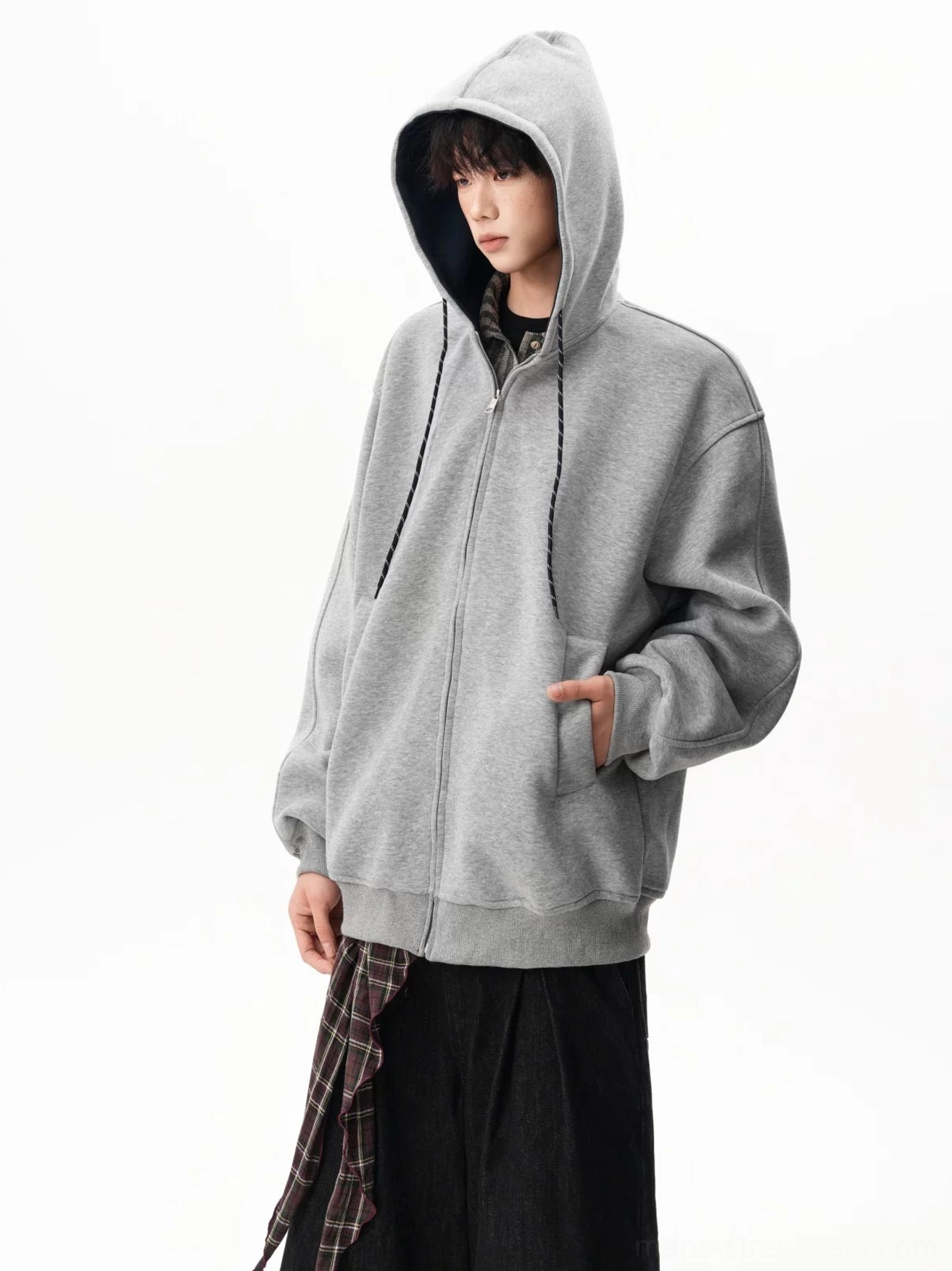 Light gray fleece zip-up hoodie worn with the hood up, full front zipper, and roomy oversized silhouette