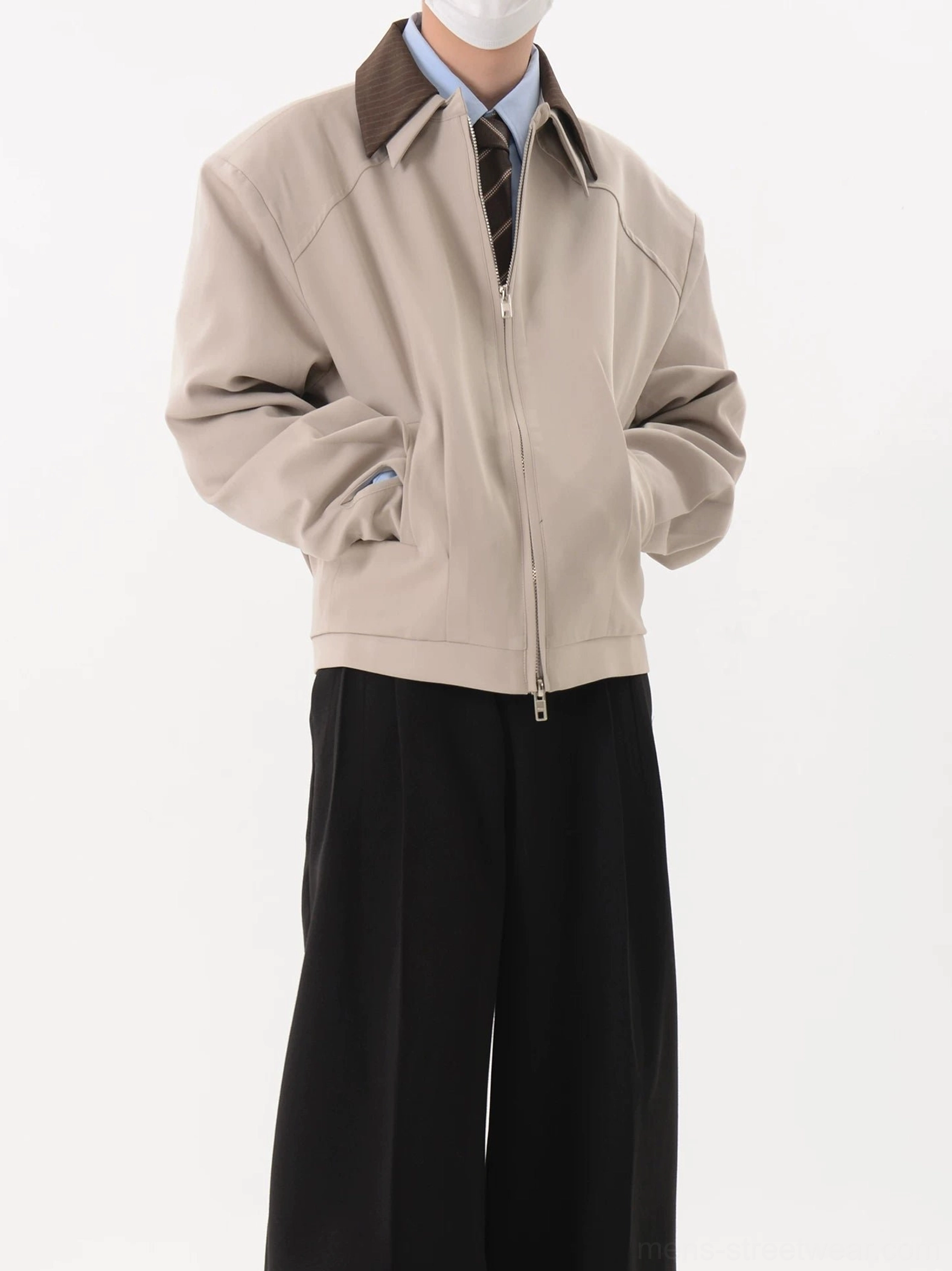 Light gray Korean contrast collar cropped zip blouson jacket worn with shirt tie and wide leg black trousers front three quarter view