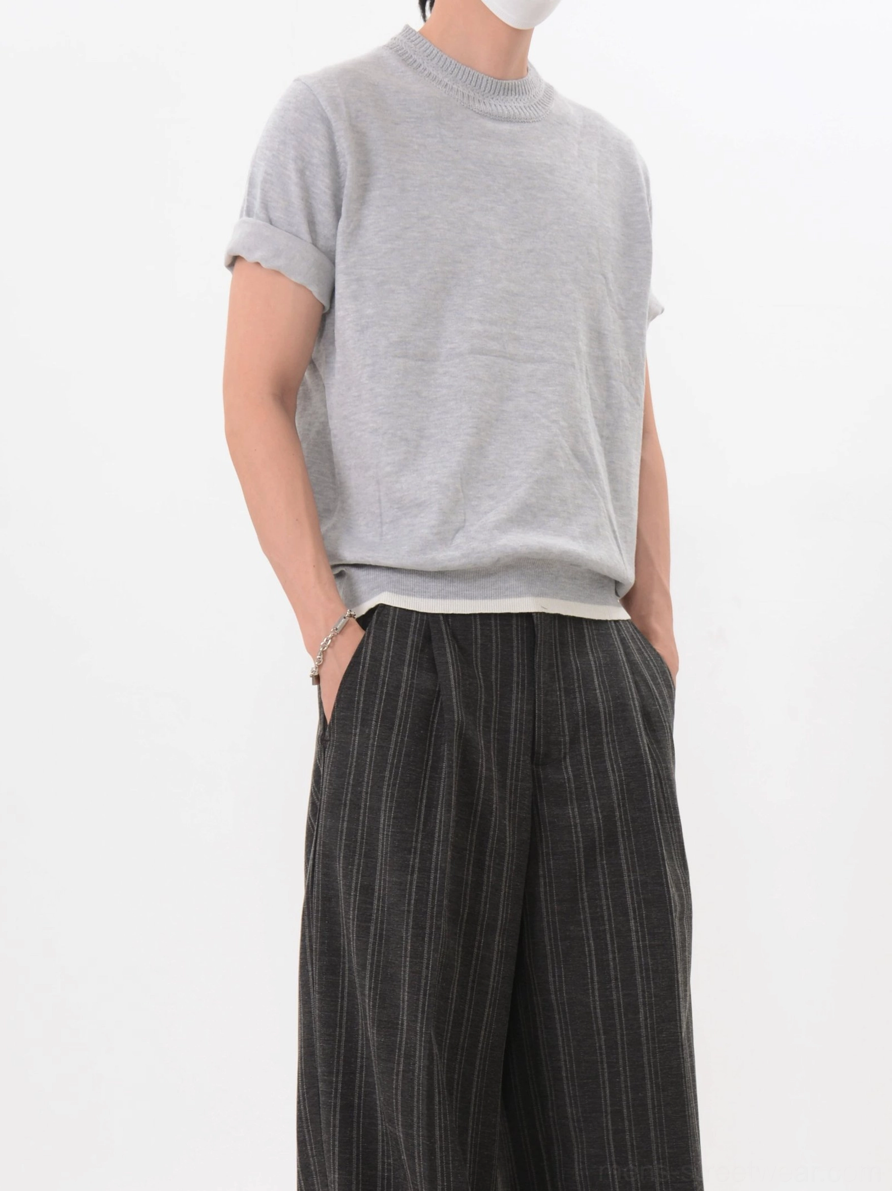 Light gray Korean streetwear knit tee with soft mock neckline, rolled cuffs, contrast white hem, and vertical striped wide leg trousers