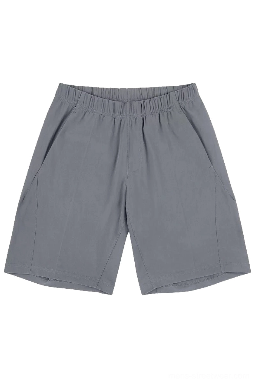 Light gray minimalist quick-dry tech shorts front view with elastic waist and discreet side pockets
