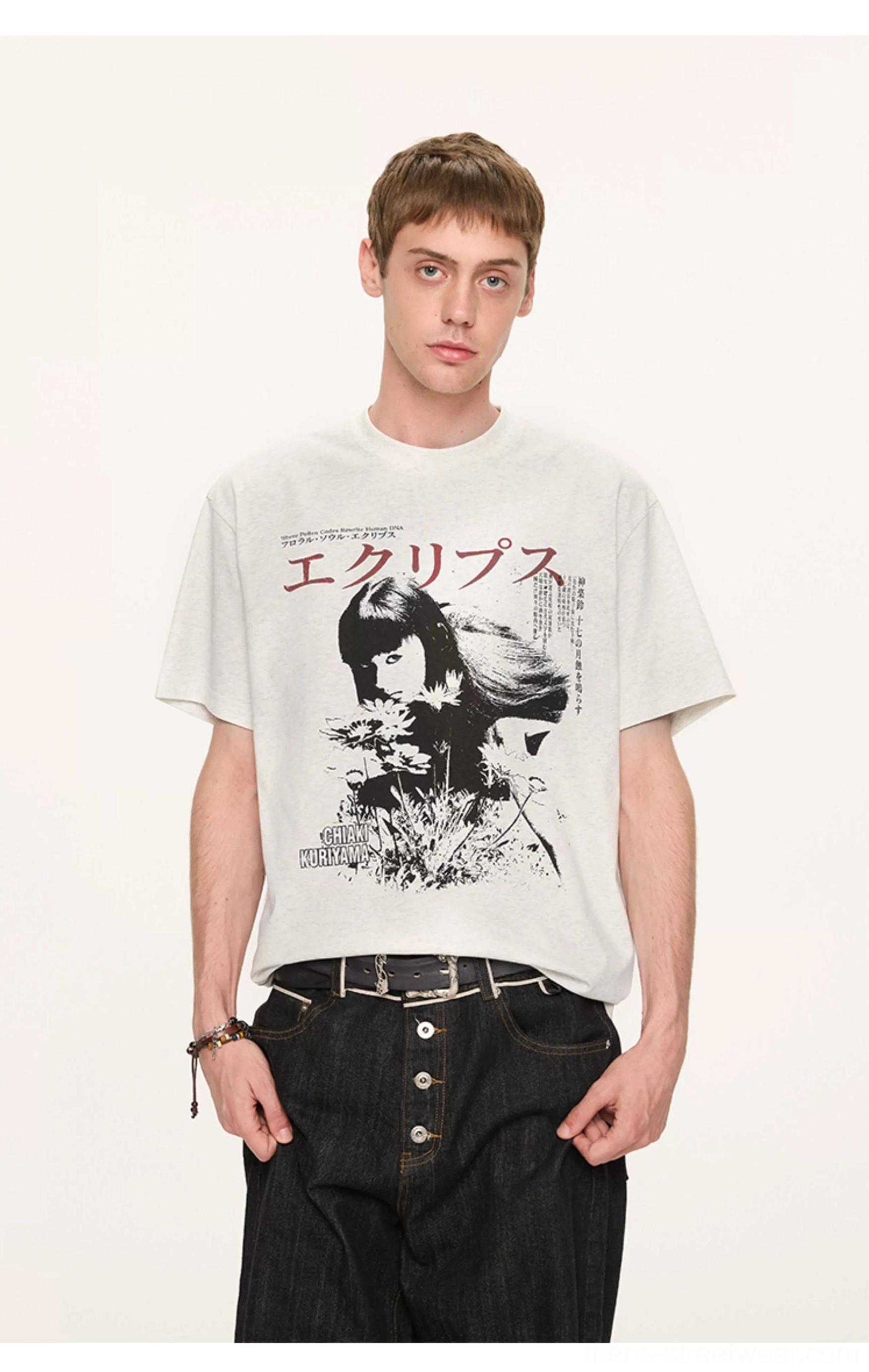 Light gray oversized Japanese graphic T-shirt with vintage anime artwork styled with high-waisted black jeans