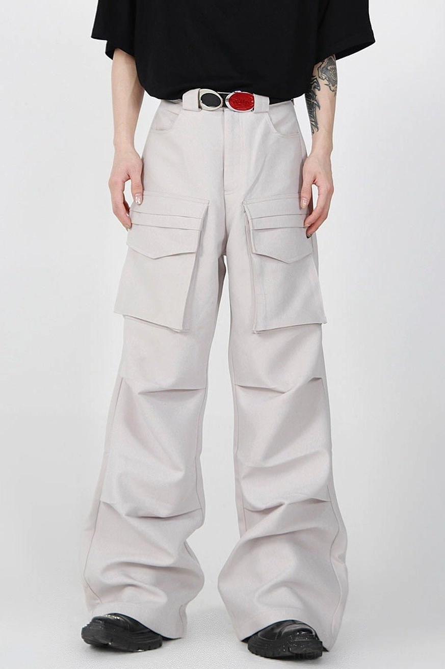 Light gray pleated wide-leg cargo pants shown from the front with high waist, dual flap pockets, relaxed oversized fit, and Seoul-inspired streetwear styling