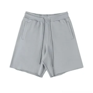 Light grey oversized sweat shorts flat lay display ribbed elastic waistband adjustable drawstring side pockets streetwear essentials