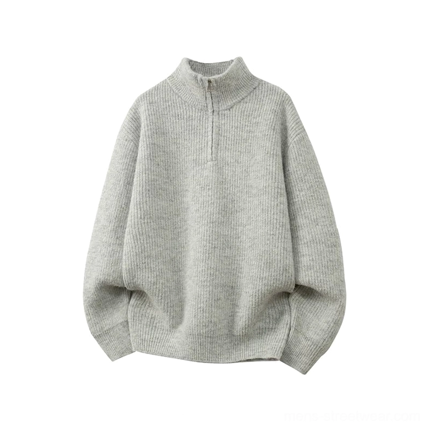 Light heather grey oversized half-zip mock neck rib knit sweater with vertical texture and relaxed drop shoulder streetwear silhouette