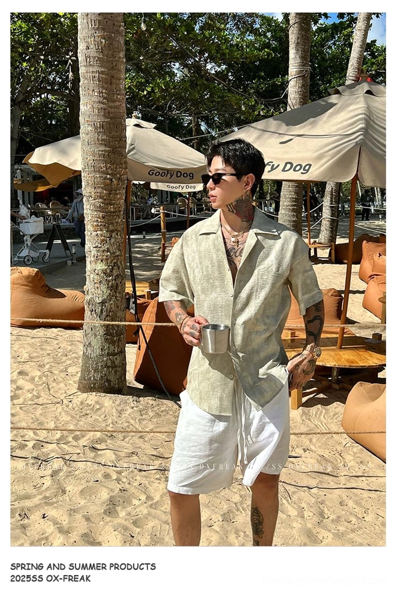 Light Khaki linen-textured Cuban collar short sleeve shirt styled with white shorts near a beach café