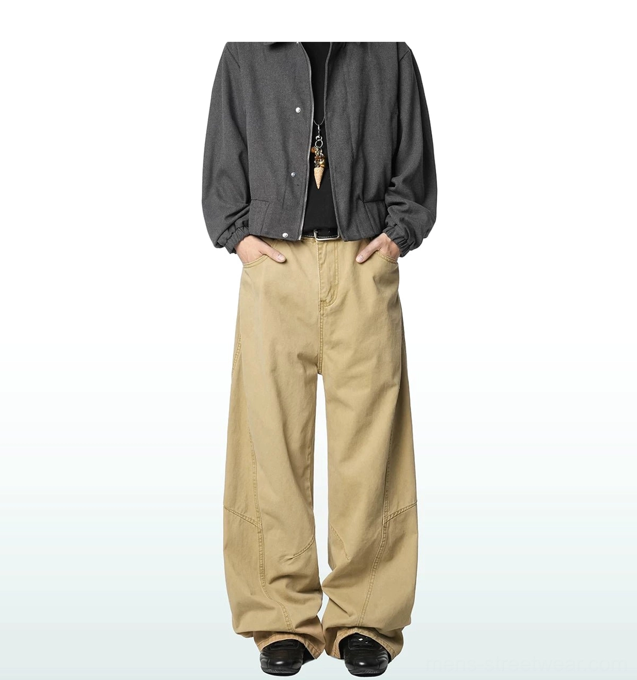 Light khaki wide-leg cotton cargo trousers shown from the front with hands in pockets, featuring a classic waistband and full relaxed leg shape