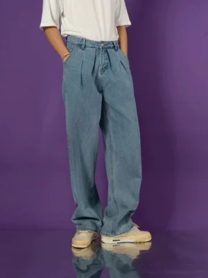Light wash wide-leg pleated denim jeans three-quarter front view showing relaxed long streetwear fit