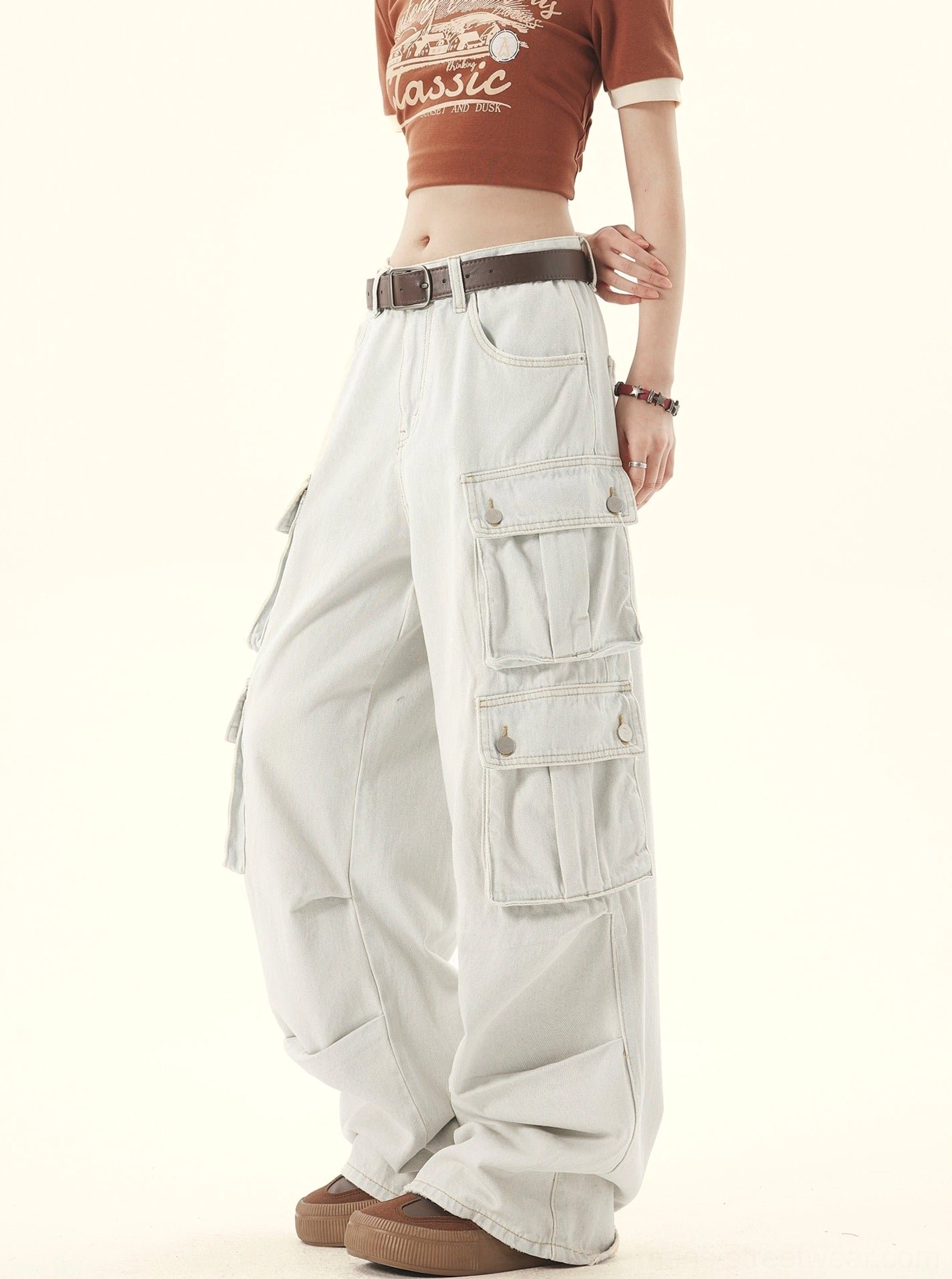 Three-quarter right view of light-washed denim cargo pants with pale bleached finish and loose streetwear fit