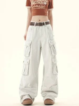 Front view of light-washed denim wide-leg cargo pants with stacked flap pockets and relaxed Korean streetwear fit