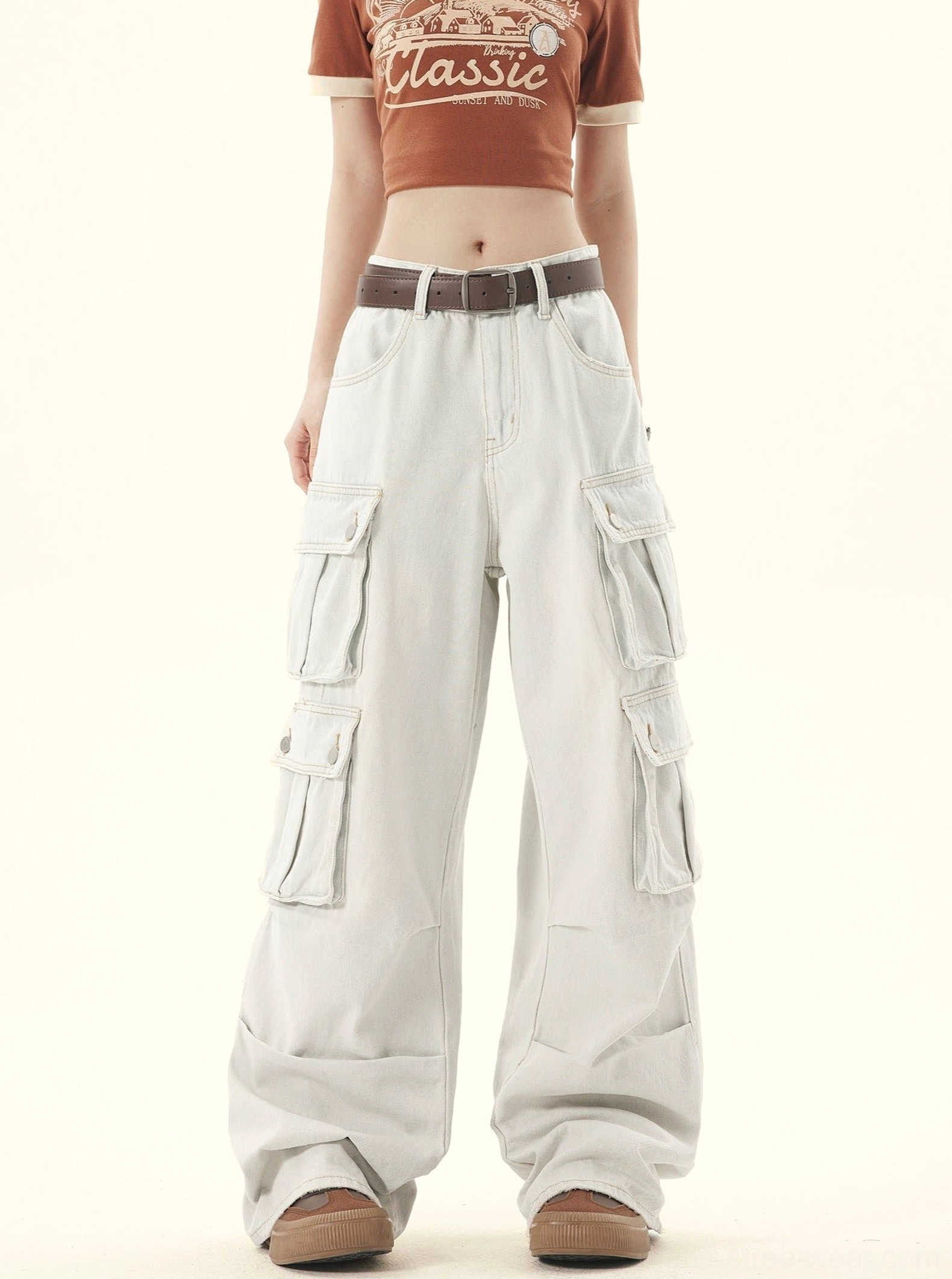 Front view of light-washed denim wide-leg cargo pants with stacked flap pockets and relaxed Korean streetwear fit