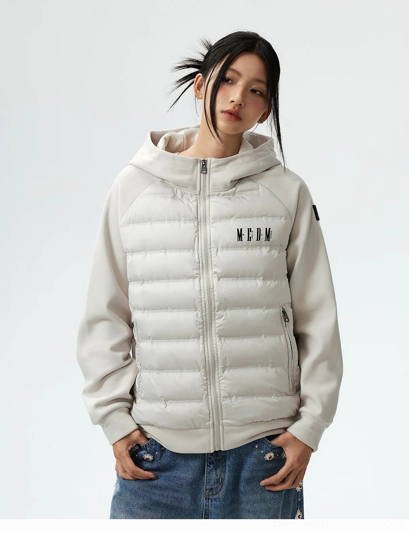 Lightweight hybrid hooded goose down jacket showing raglan sleeve fit hood construction and ribbed hem detail