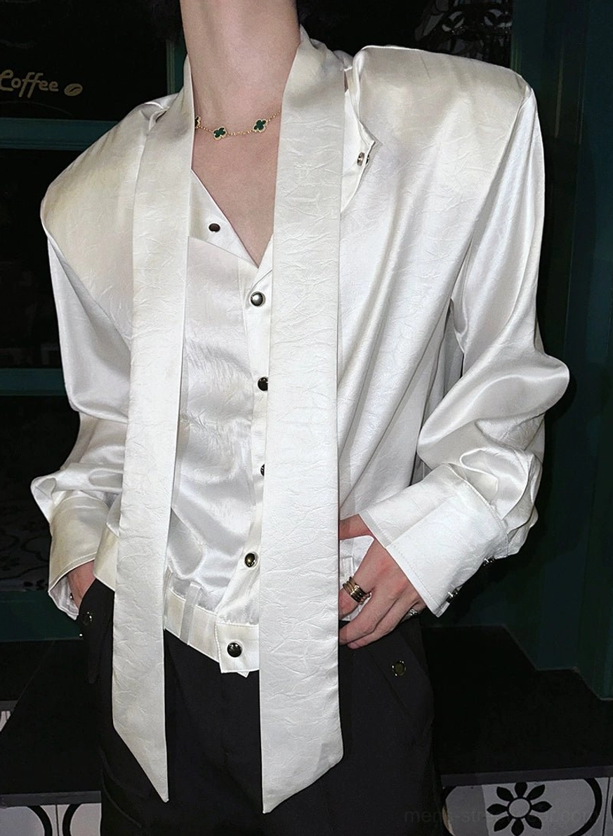 Long-sleeve glossy tie-neck button-up shirt with structured drape and modern streetwear attitude