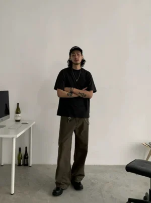 Loose fit crew neck cotton blend t-shirt worn with wide leg brown trousers in a modern Korean streetwear outfit