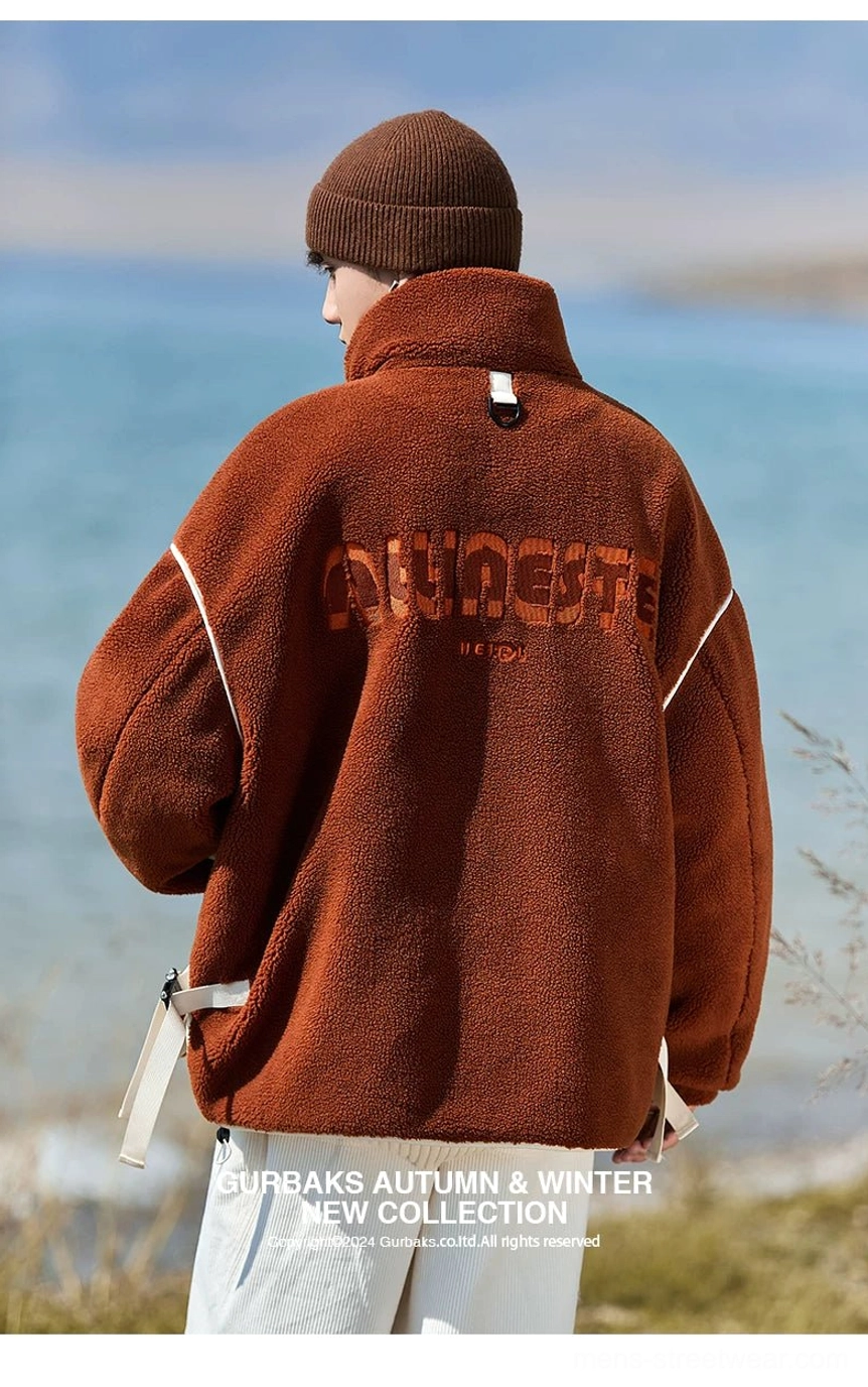 Rear full-body view of a loose oversized sherpa jacket with dropped shoulders, back lettering, and hanging side drawstring