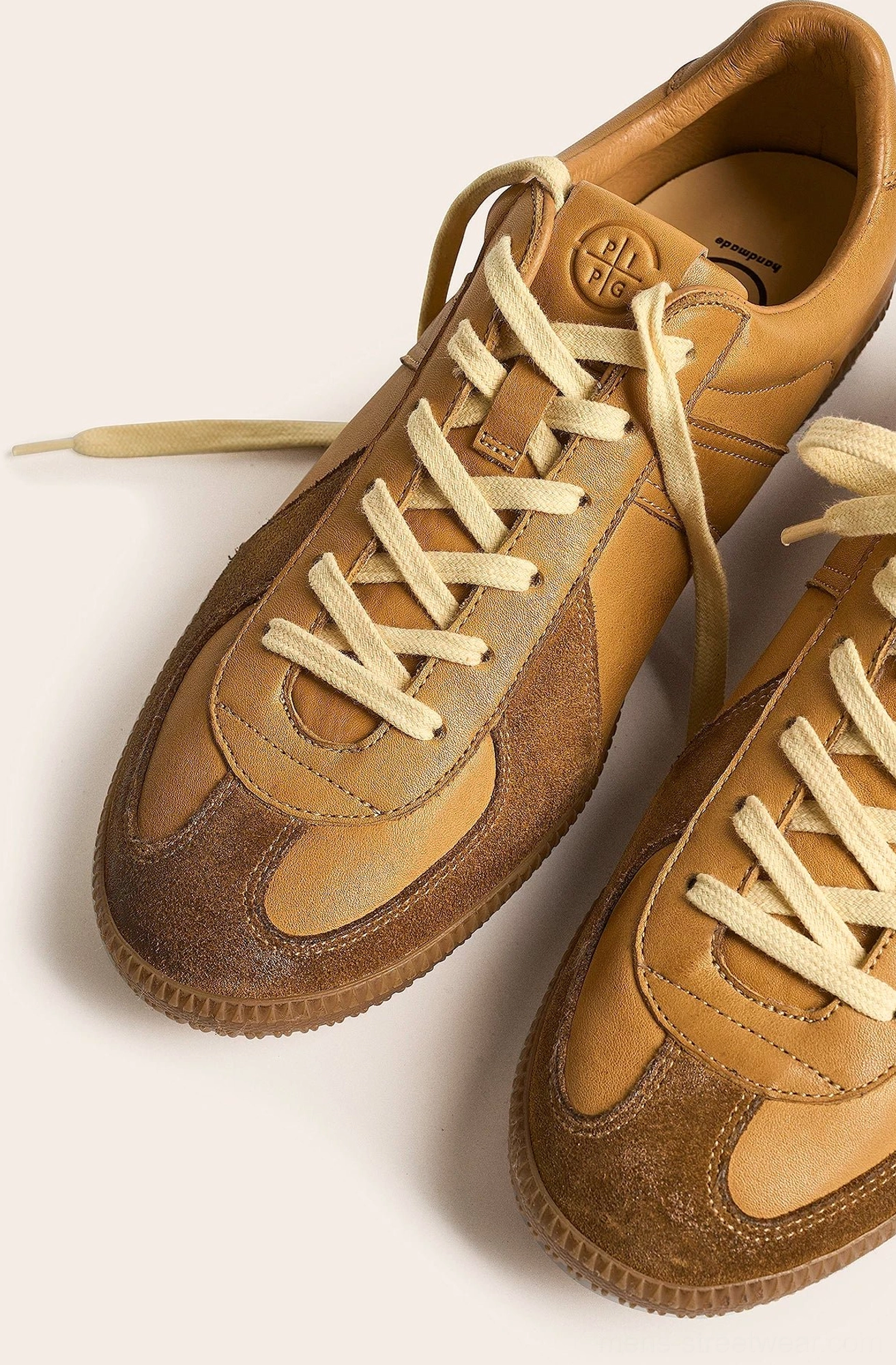 Classic low profile leather trainer sneakers with suede accents contrast stitching and cushioned support