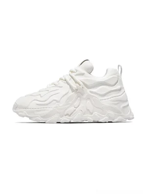 White MagmaFlow Sculpt chunky sneakers with fluid wave embossed leather upper, thick rubber platform outsole, lace-up closure, and rear pull tab shown from a left side angle