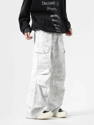 Marble light grey wash slouch cargo pants with wide-leg Korean streetwear fit, flap thigh pockets, and stacked silhouette styled with a black graphic hoodie
