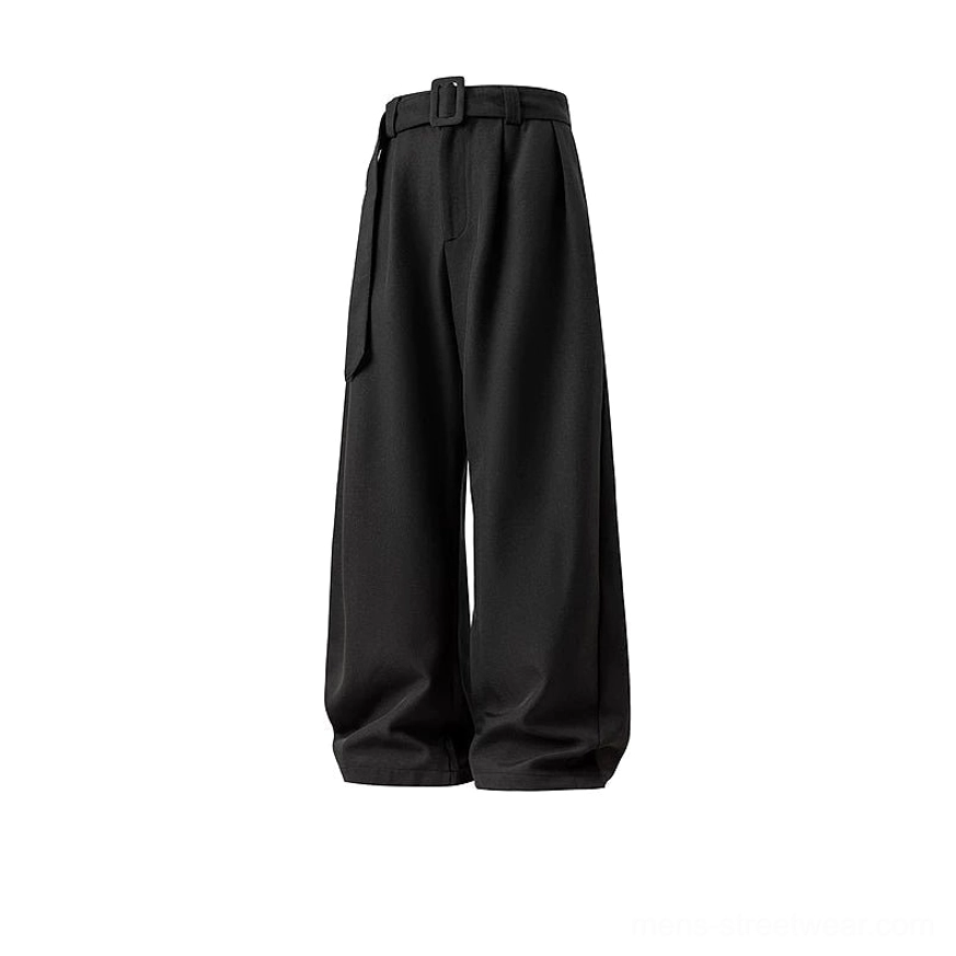 Flat product view of matte black belted wide-leg trousers with pleated front, oversized curved legs, and contemporary Korean streetwear styling