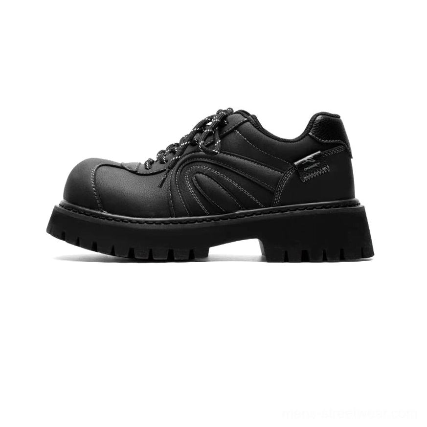 Matte black chunky suede-effect work sneakers with matching black laces, contrast stitching, structured panels, and rugged platform lug outsole