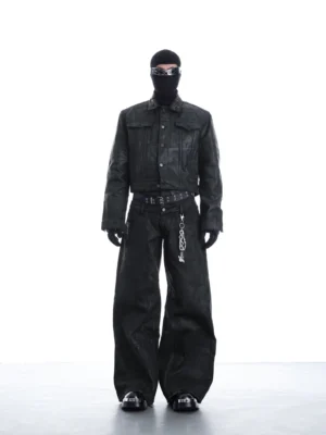 Matte black distressed faux leather cropped trucker jacket styled with an all-black Korean streetwear outfit and chain belt