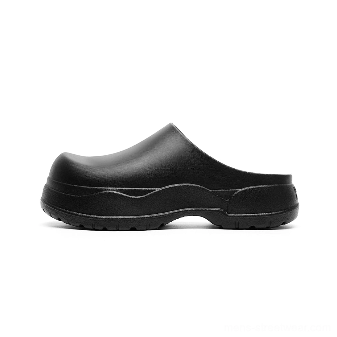 Matte black slip-on mule clogs with rounded closed toe, curved chunky outsole, and elevated platform profile