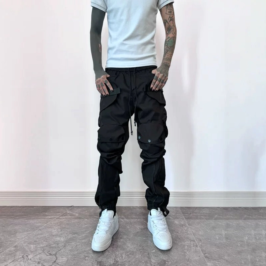 Matte black tactical cargo joggers full front view with structured pockets, adjustable waist and elastic ankle cuffs