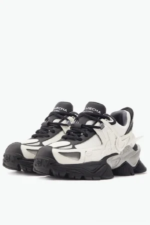 Front paired view of black and white mecha platform sneakers with breathable mesh uppers and chunky mechanical streetwear soles