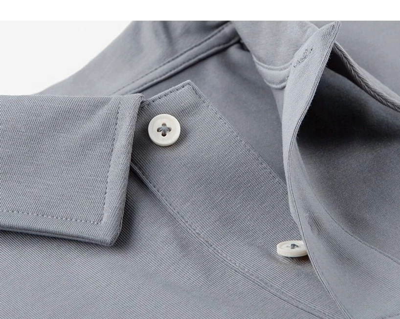 Medium grey technical pocket polo shirt collar and light resin button detail with precise stitching for modern streetwear