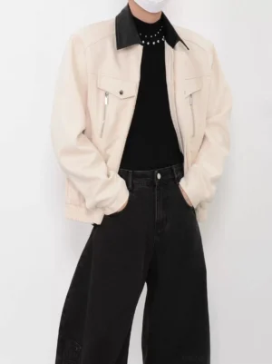 Apricot contrast collar faux suede bomber jacket for men shown in front three-quarter view with black streetwear outfit