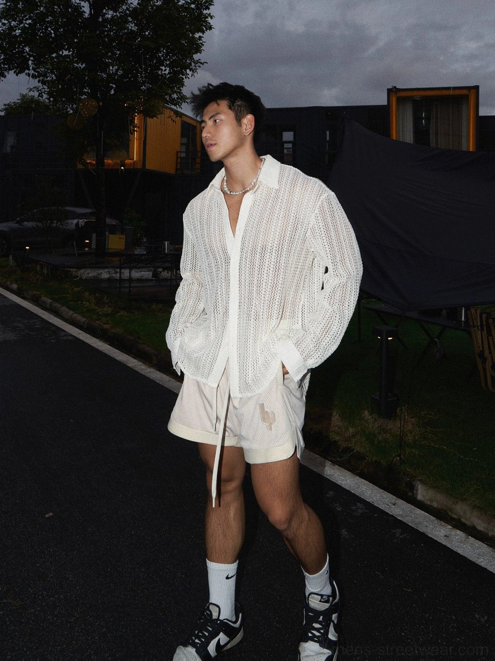 Men's apricot long-sleeve open-knit crochet shirt in relaxed fit paired with beige drawstring shorts