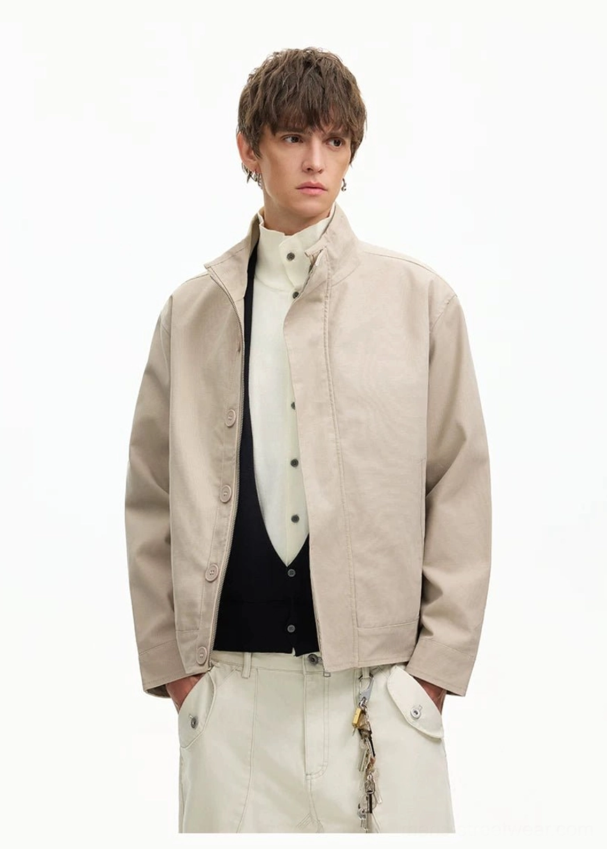 Men's apricot minimalist Harrington jacket front view showing stand collar button placket and side pockets