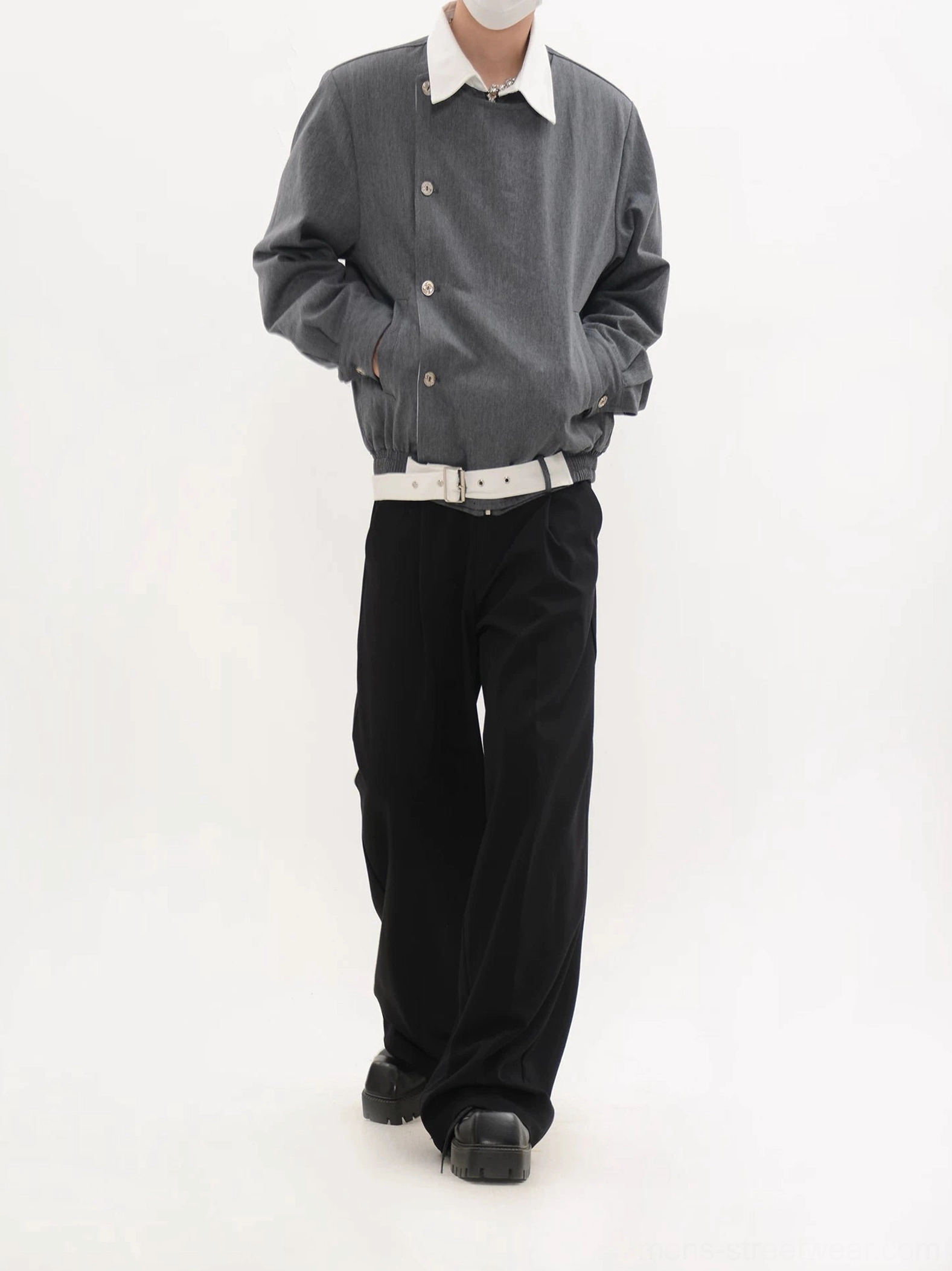 Gray asymmetric button front cropped blouson jacket with diagonal metal buttons and side pockets worn in a full outfit