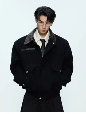 Men's black contrast collar workwear bomber jacket front view styled with shirt and tie in minimalist studio