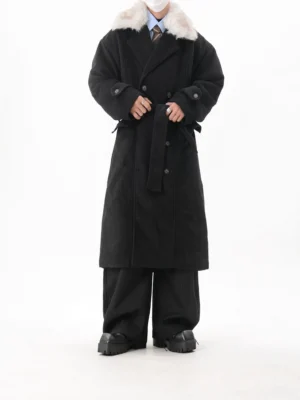 Men's black faux fur collar belted double-breasted long coat shown in a full-body front view with tailored shirt and wide-leg trousers