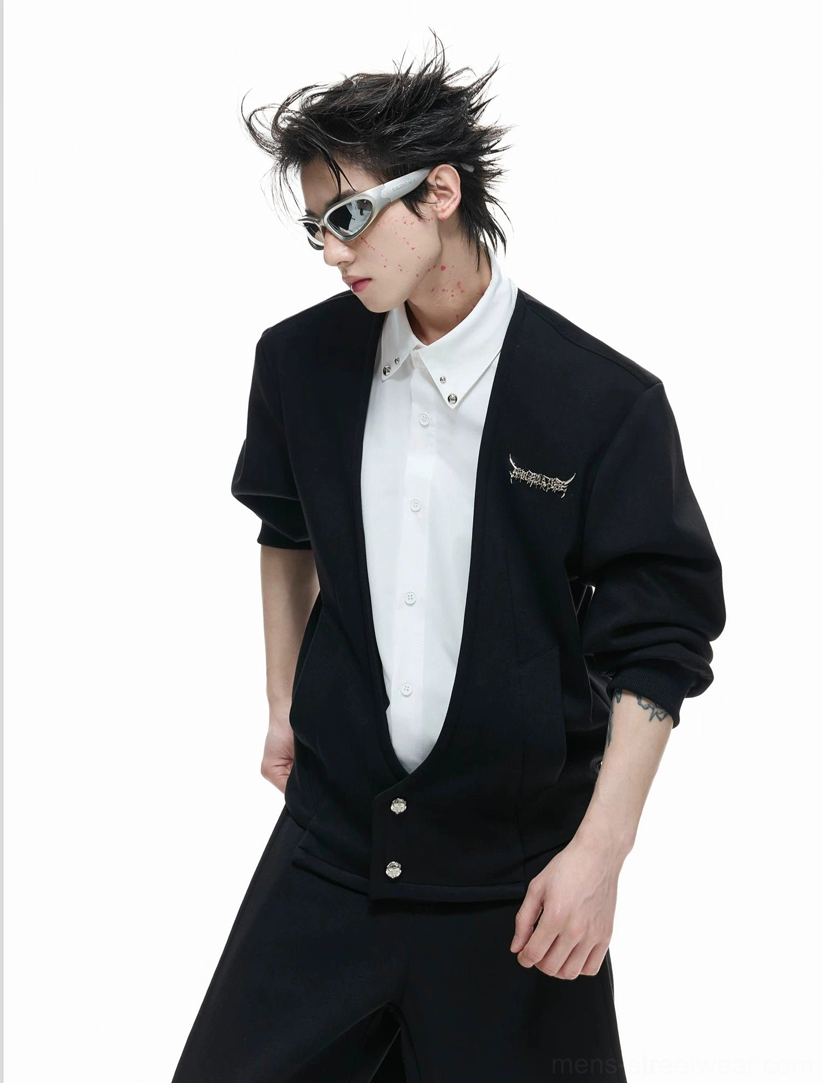 Side view of men's black faux-twinset streetwear outfit styled with futuristic sunglasses and relaxed proportions