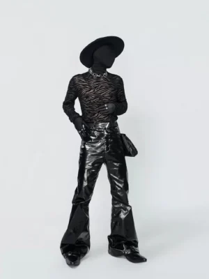 Mens black sheer zebra turtleneck long-sleeve top shown in a three-quarter dark avant-garde streetwear outfit