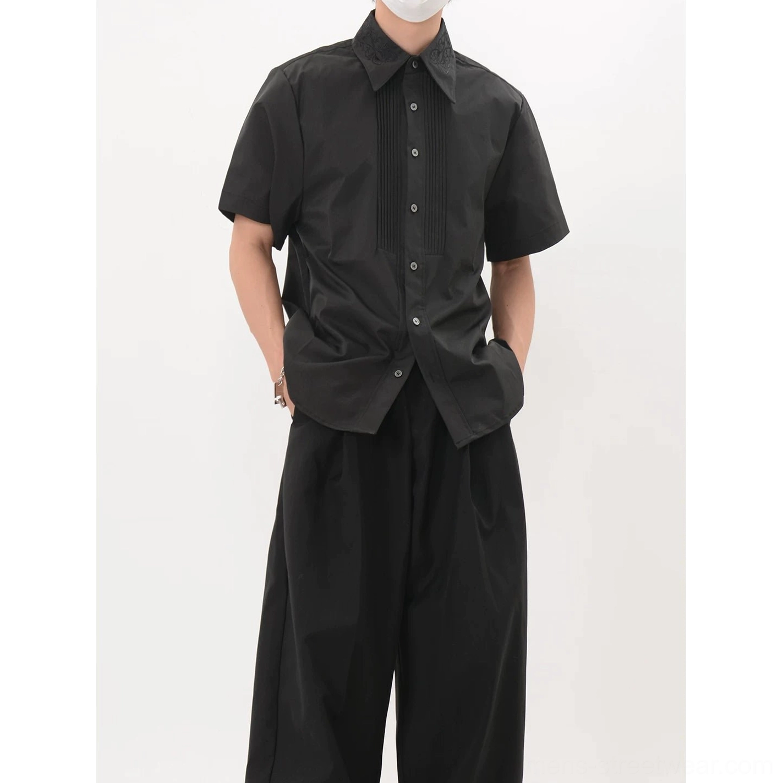 Men's black tuxedo inspired pleated shirt with decorative buttons and vertical front tuck pleats
