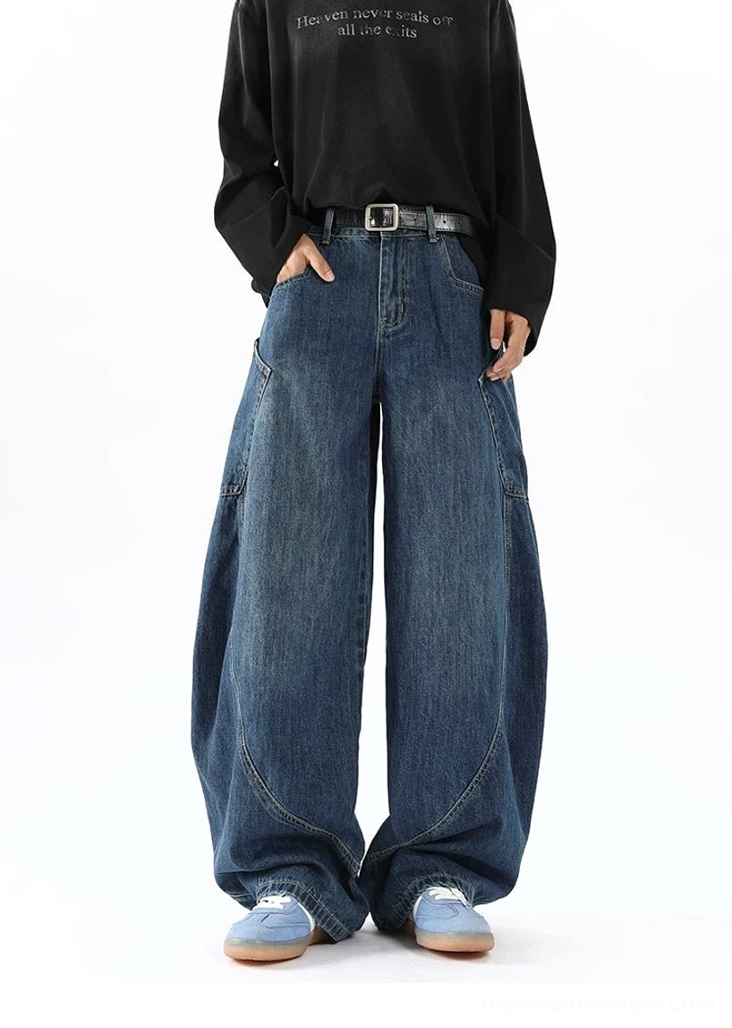 Men's blue balloon leg denim cargo pants right-side view highlighting roomy baggy fit side pocket and classic indigo denim texture