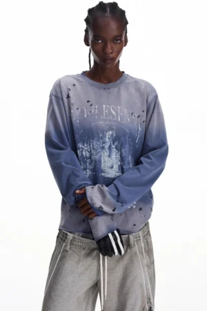 Front view of men's blue-gray vintage gradient graphic streetwear sweatshirt with distressed splatter dye and relaxed crewneck fit
