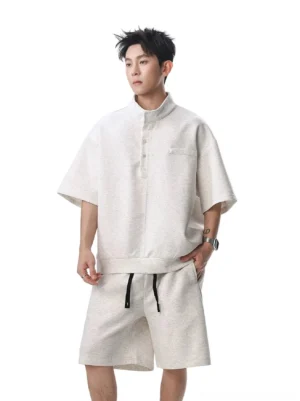 Apricot men's boxy stand collar fleece Henley streetwear shirt styled with matching drawstring shorts, full front studio view