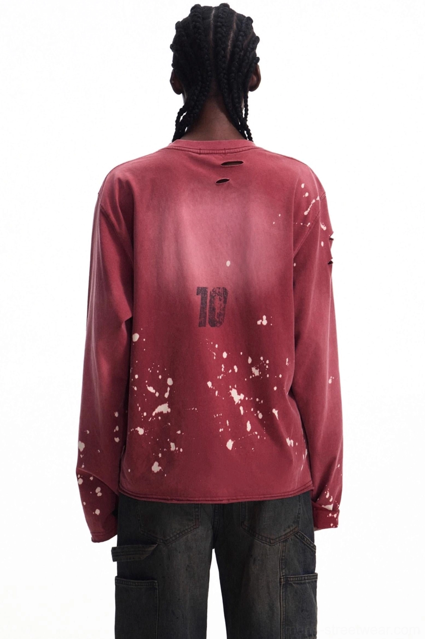 Back view of a men's burgundy distressed vintage long-sleeve streetwear T-shirt with upper back number 10 print, white splatter marks, worn collar, and distressed sleeves
