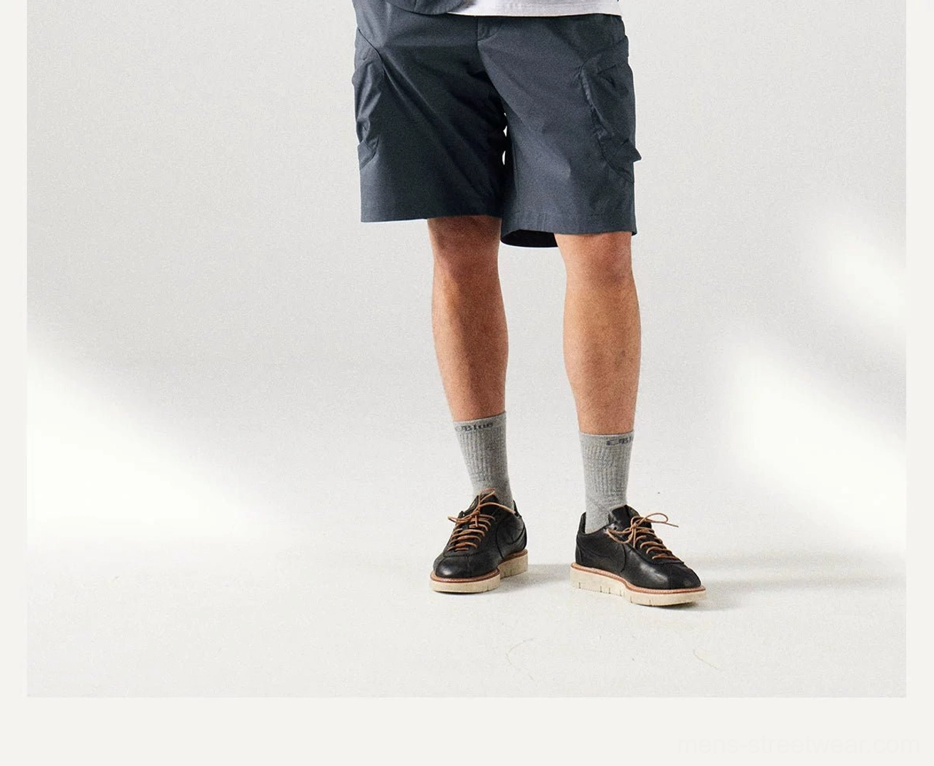Men's casual utility shorts with moisture-wicking performance, sun protection, adjustable elastic waistband, and versatile streetwear styling