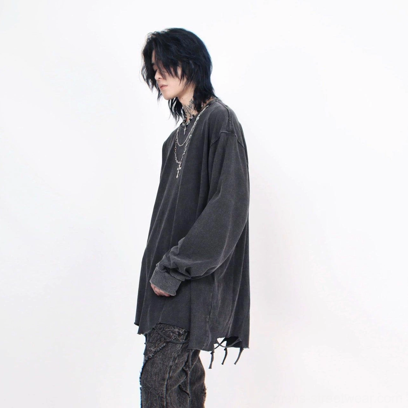 Back three-quarter view of charcoal distressed oversized long-sleeve streetwear tee with loose silhouette