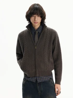 Men's coffee brown textured full-zip stand collar knit cardigan styled with plaid shirt tie and dark jeans front view