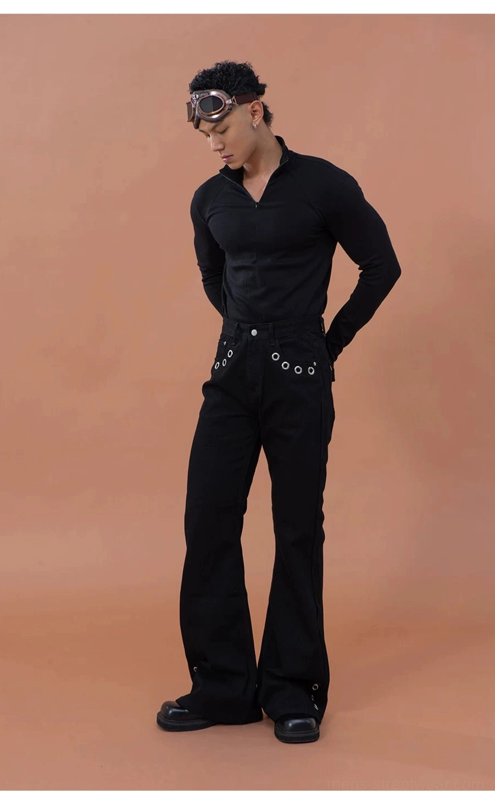Dark gray men's slim-fit quarter-zip streetwear top styled with black flared trousers for a modern city outfit