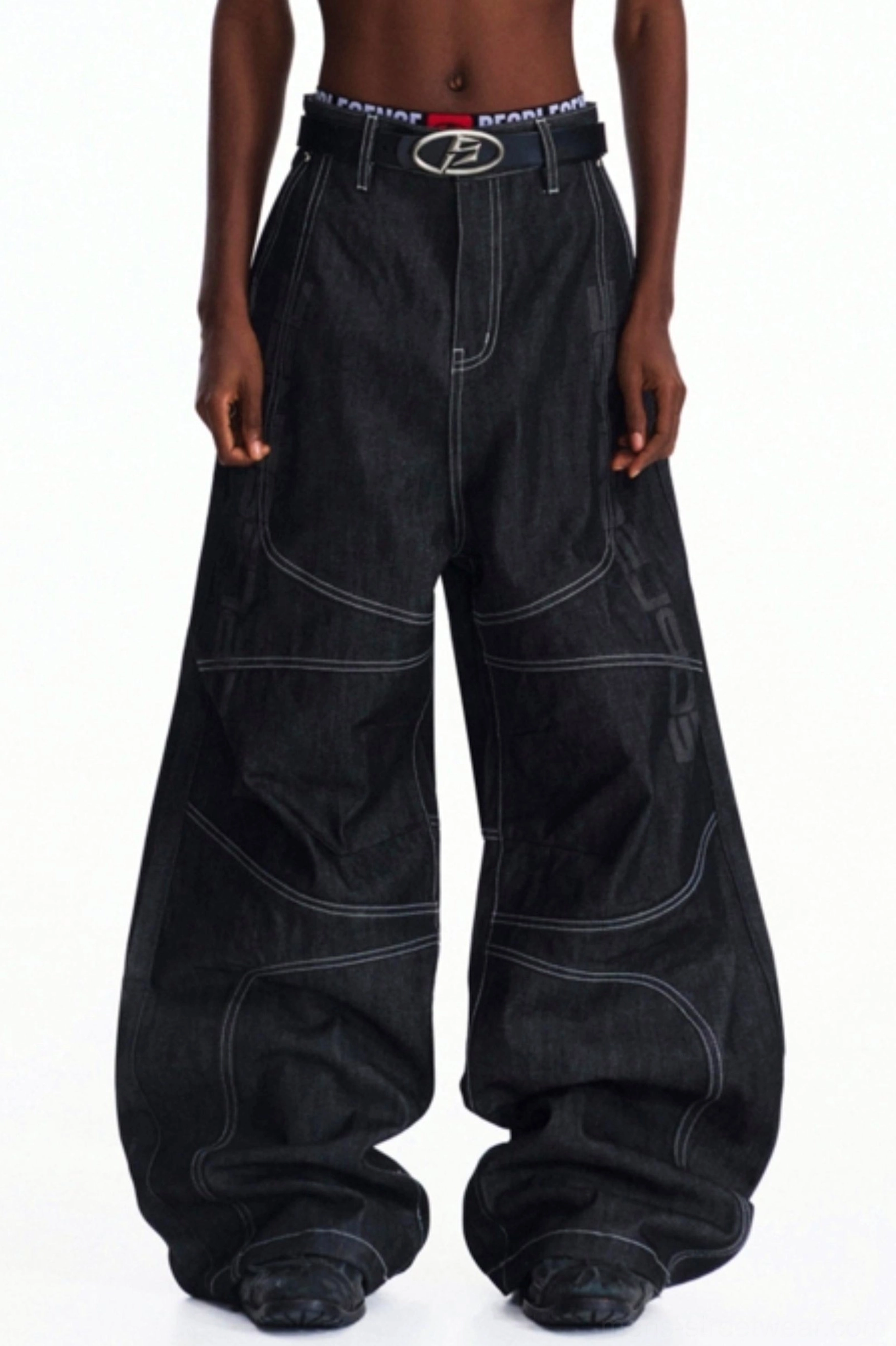 Full front view of men's dark wash wide-leg jeans with relaxed oversized fit, contrast stitching, high-waisted streetwear design, and belt styling