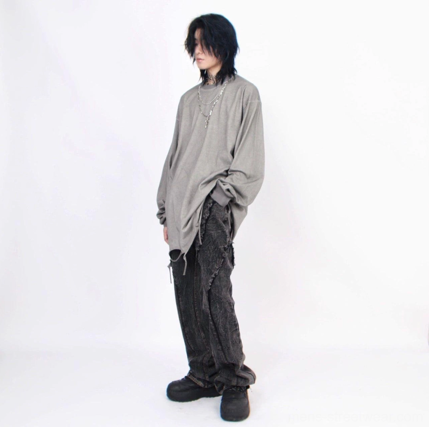 Men's distressed oversized long-sleeve tee with cross necklace in modern East Asian streetwear style